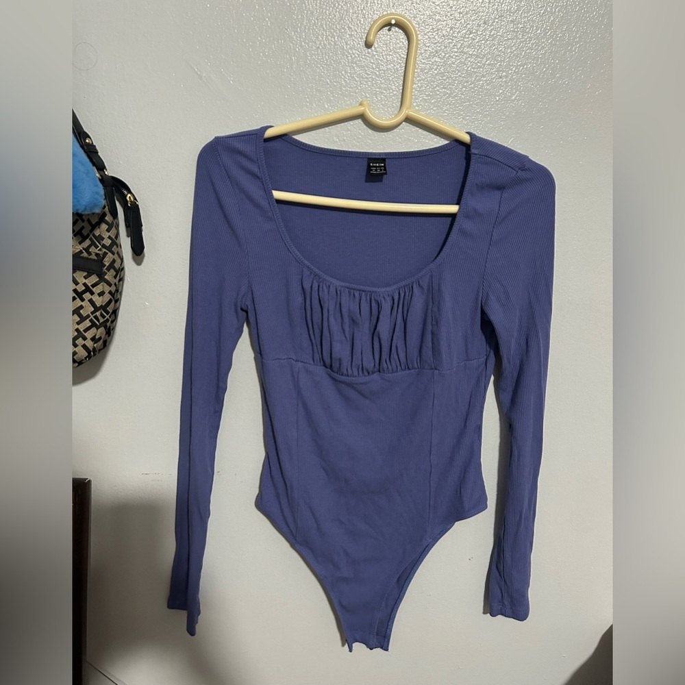 Blue and purplish body suit